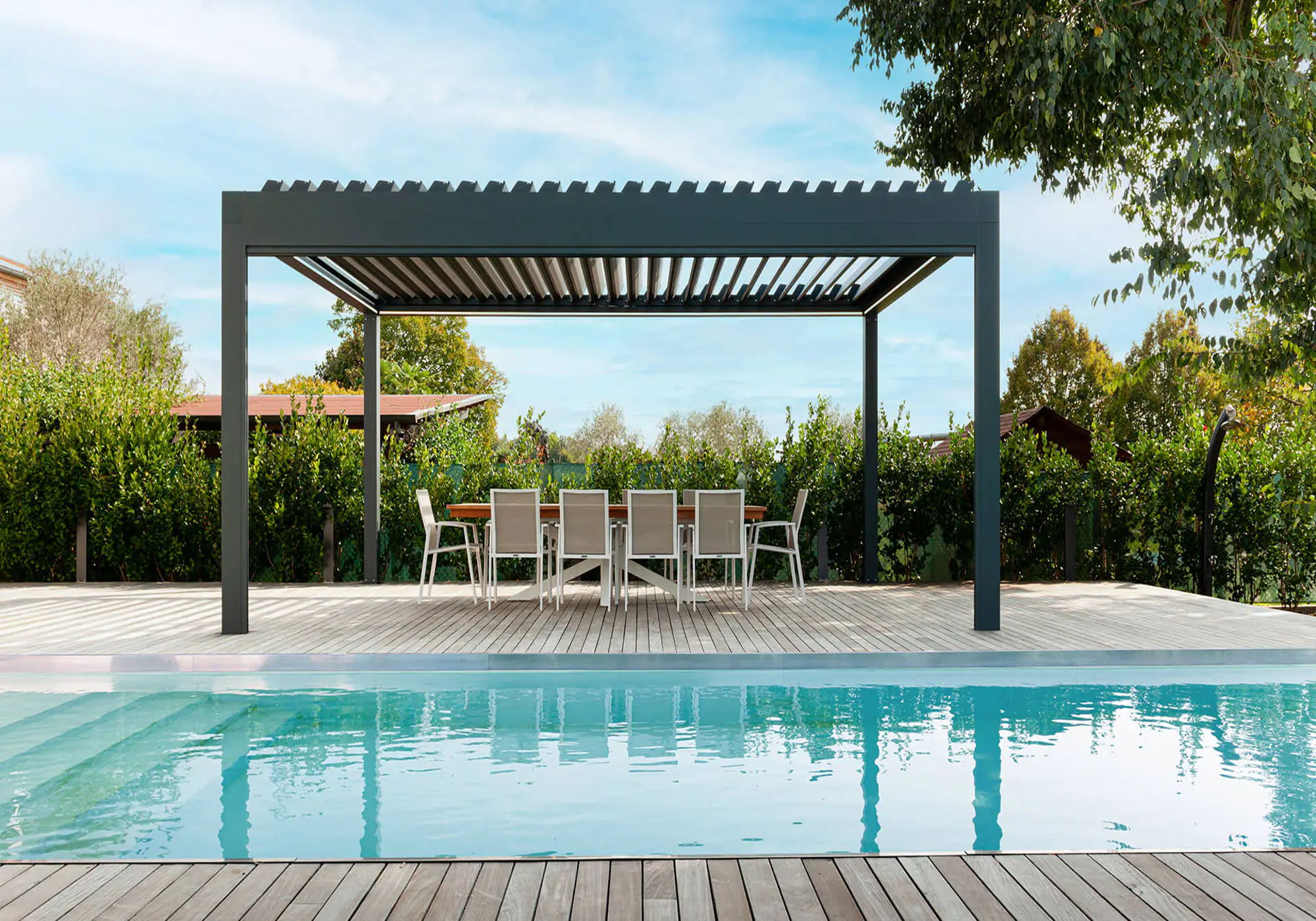 Modern pergola shading a poolside lounge